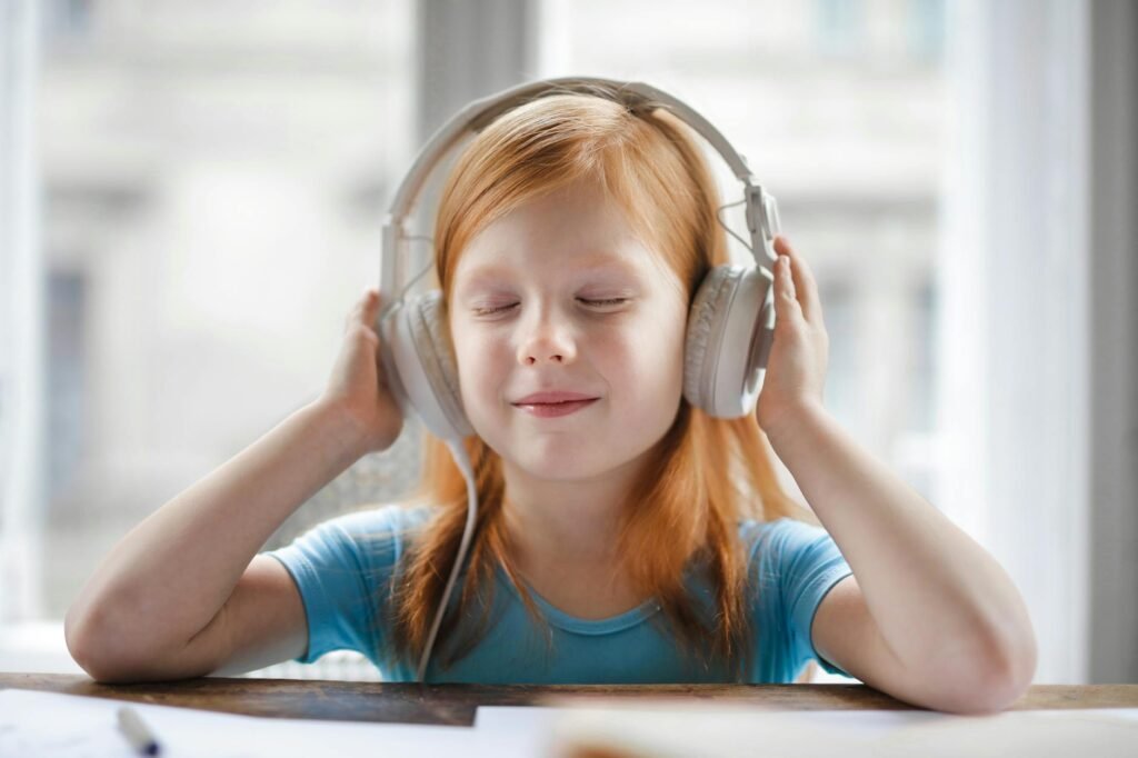 photo of girl listening to music